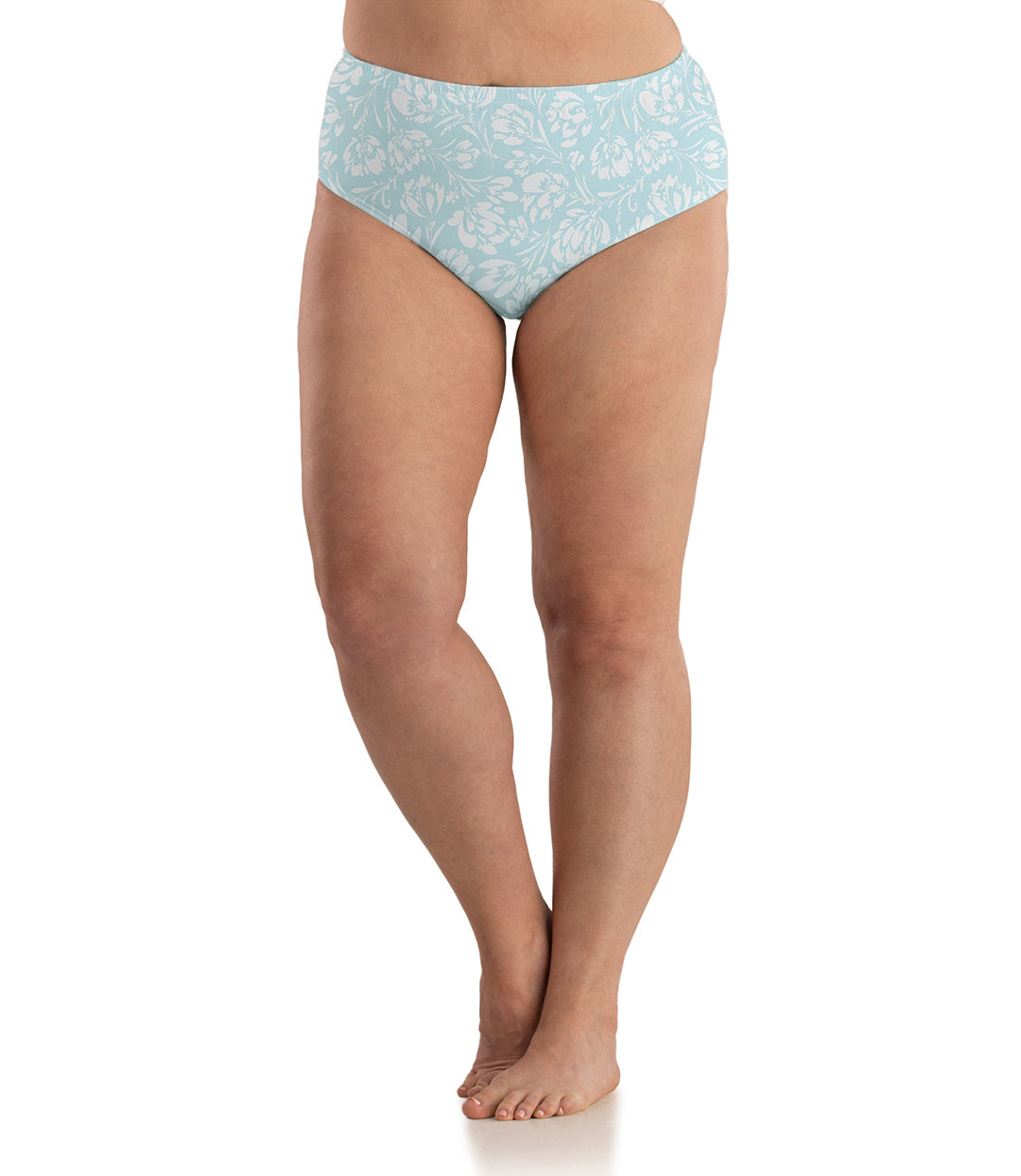 Bottom half of plus sized woman, front view, wearing JunoActive Junowear Cotton Stretch Classic Brief in spring blue floral print. This brief fits to the waistline with conservative leg opening. Print has white flowers on a light blue green background.