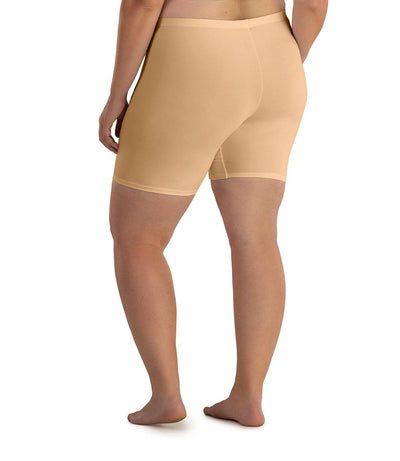 Plus size woman, back view, wearing JunoActive Junowear Cotton Stretch Fitted Boxer. The hemline is a few inches above knee in color taupe.