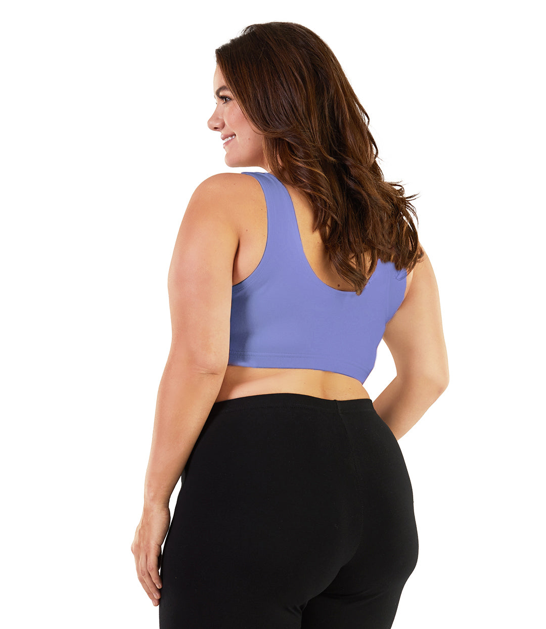 Plus size woman, facing back, wearing JunoActive plus size Stretch Naturals Scoop Neck Bra in cornflower blue. The woman is wearing black plus size JunoActive leggings. Her arms fall naturally to her side. 