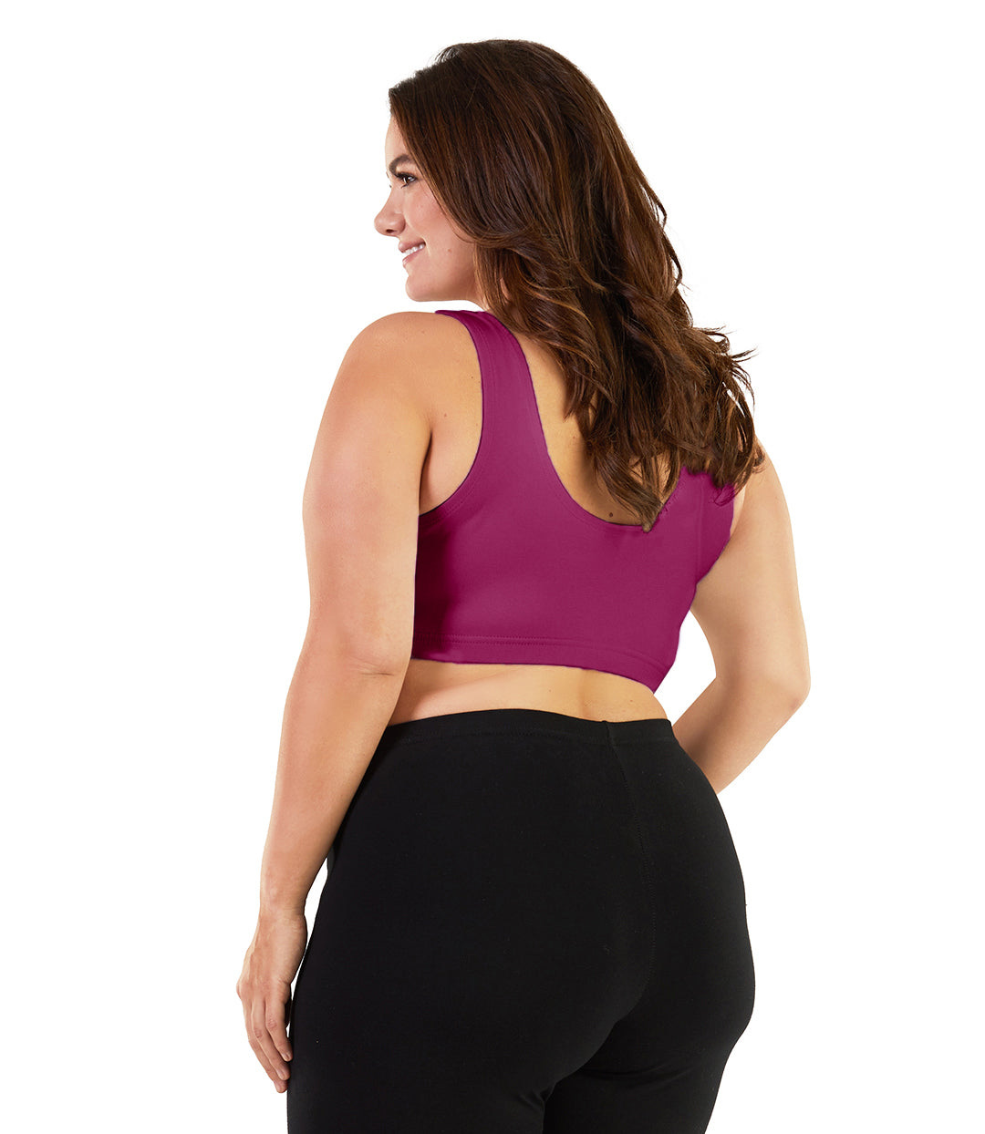 Plus size woman, facing back, wearing JunoActive plus size Stretch Naturals Scoop Neck Bra in Merlot. The woman is wearing black plus size JunoActive leggings. Her arms fall naturally to her side.