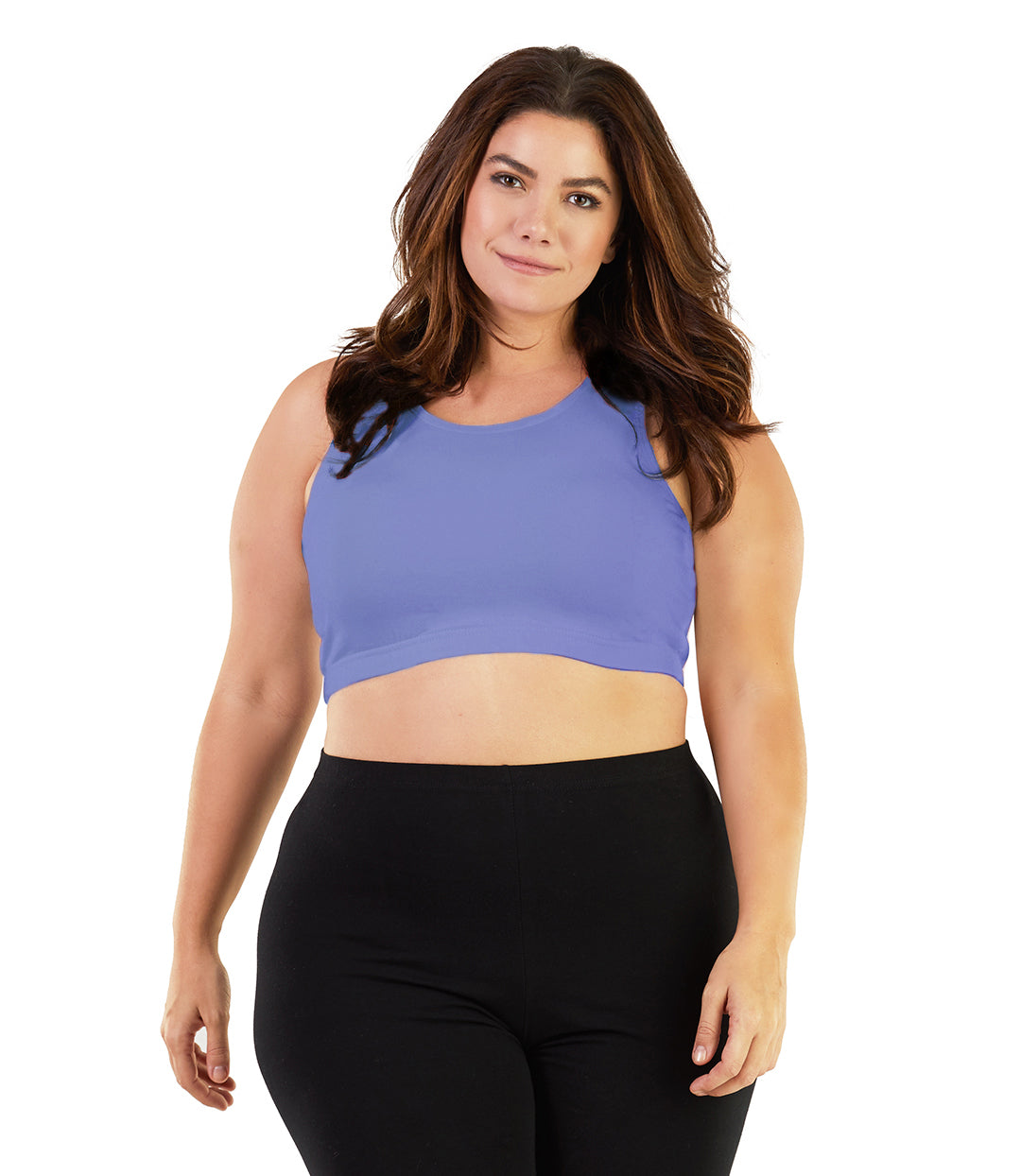 Plus size woman, facing front, wearing JunoActive plus size Stretch Naturals Scoop Neck Bra in cornflower blue. The woman is wearing black JunoActive plus size leggings. Her arms fall naturally to her side. 