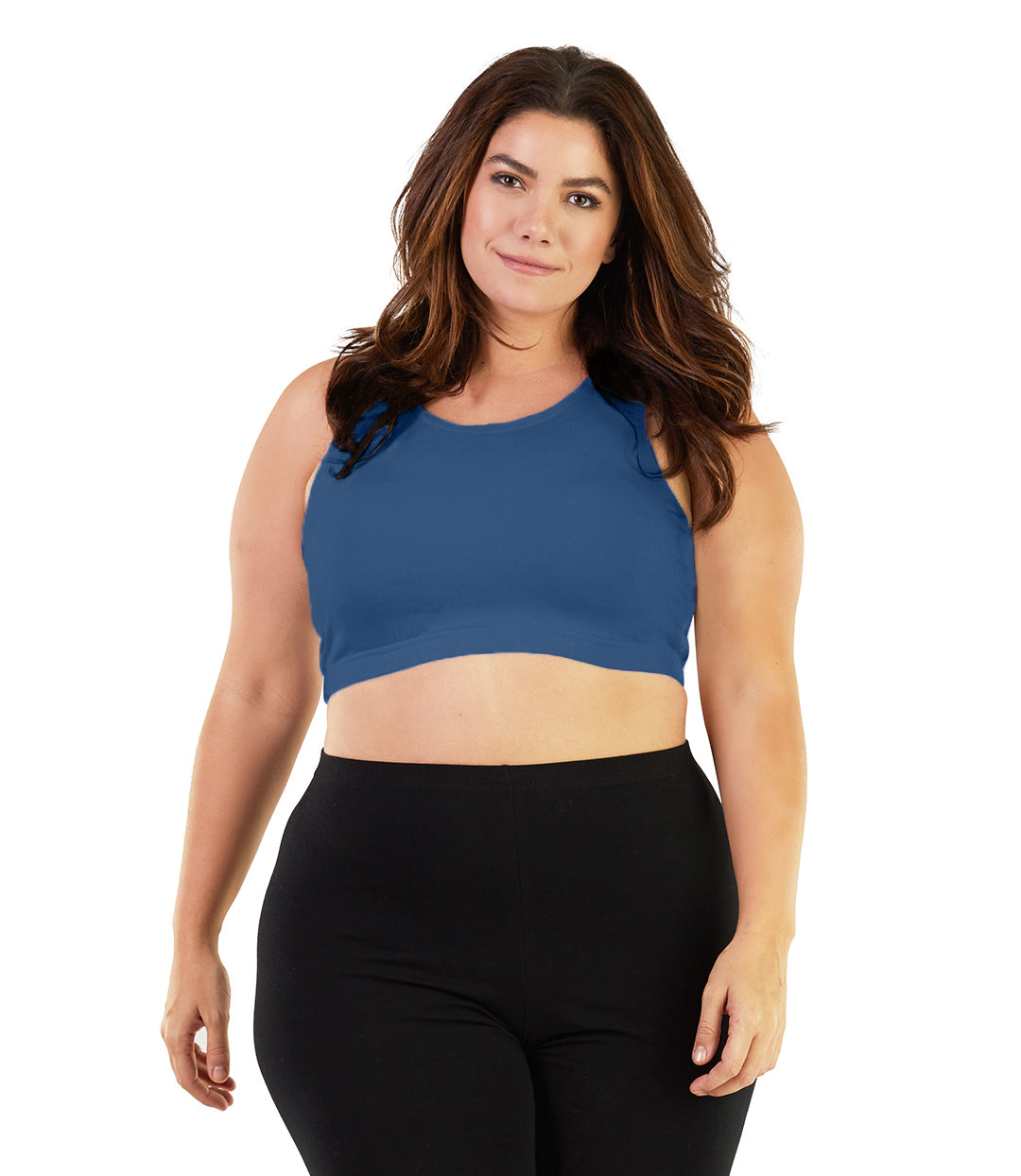  Plus size woman, facing front, wearing JunoActive plus size Stretch Naturals Scoop Neck Bra in french blue. The woman is wearing black plus size JunoActive leggings. Her arms fall naturally to her side. 
