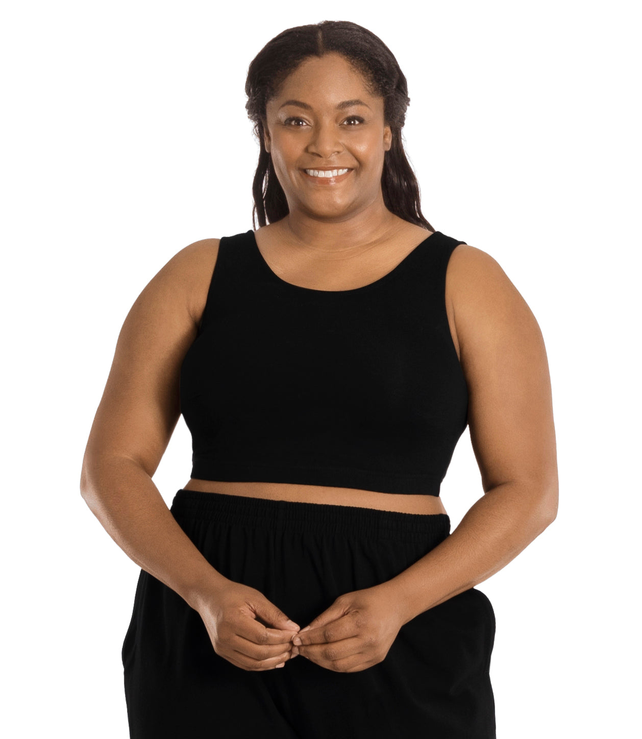 Plus size woman, facing front, wearing JunoActive plus size Stretch Naturals Scoop Neck Full Fit Bra in black. She's wearing black pants and her arms fall naturally to her side and hands come to a point touching.