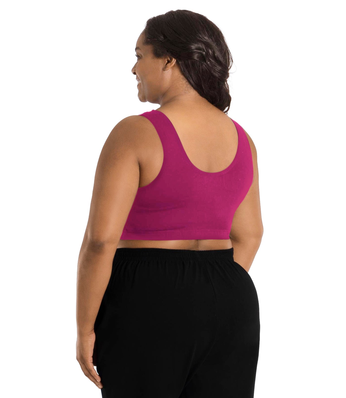 Plus size woman, facing back, wearing JunoActive plus size Stretch Naturals Scoop Neck Bra in Merlot. The woman is wearing black JunoActive plus size bottoms. Her arms fall naturally to her side.