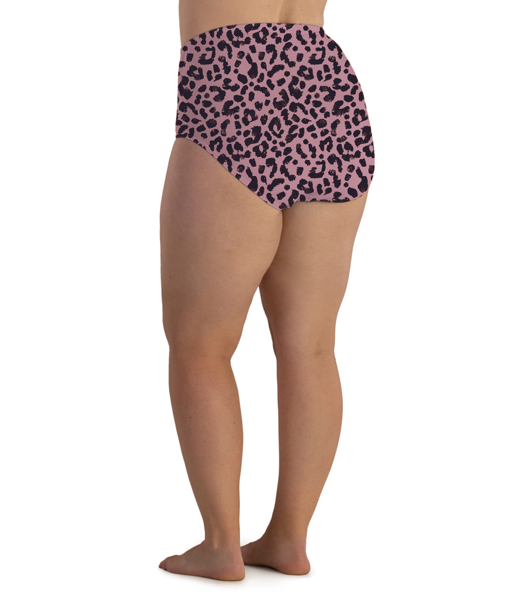 Plus size woman, facing back, wearing JunoActive’s  Junowear cotton stretch full fit brief in color jungle rose print. 
