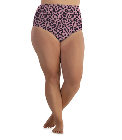 Plus size woman, facing front, wearing JunoActive’s  Junowear cotton stretch full fit brief in color jungle rose print. 
