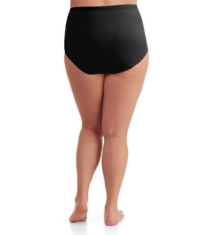 Bottom half of plus sized woman, back view, wearing JunoActive Junowear Cotton Stretch Classic Full Fit Brief in black. This brief has a high waist fit with conservative leg opening.