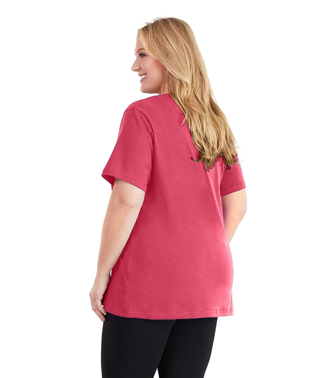 Plus size woman, facing back and looking left, wearing JunoActive plus size Stretch Naturals V-Neck in the color Coraline. She is wearing JunoActive Plus Size Leggings in the color black.