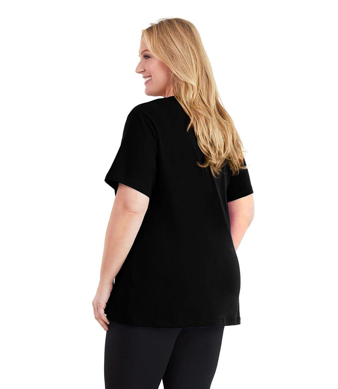 Plus size woman, facing back and looking left, wearing JunoActive plus size Stretch Naturals V-Neck in the color Black. She is wearing JunoActive Plus Size Leggings in the color black.