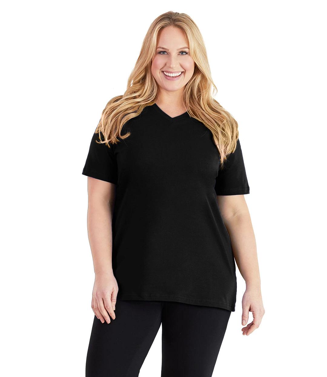 Plus size woman, facing front, wearing JunoActive plus size Stretch Naturals V-Neck in the color Black. She is wearing JunoActive Plus Size Leggings in the color black. 