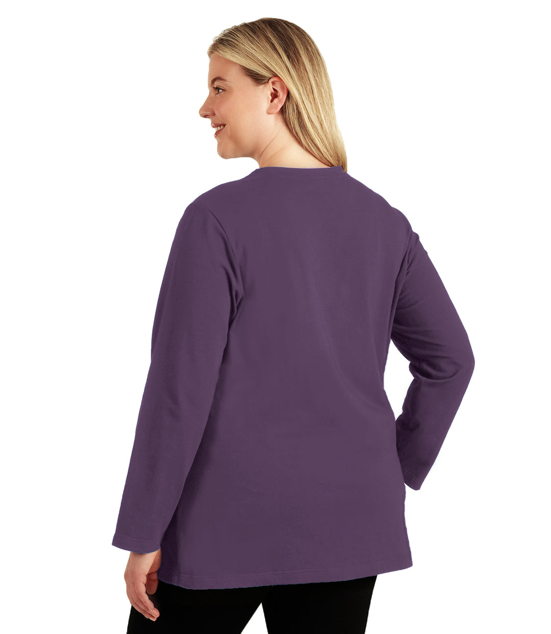Plus size woman, facing back looking left, wearing JunoActive plus size Stretch Naturals Long Sleeve V-Neck Top in the color Black Berry. She is wearing JunoActive Plus Size Leggings in the color Black.