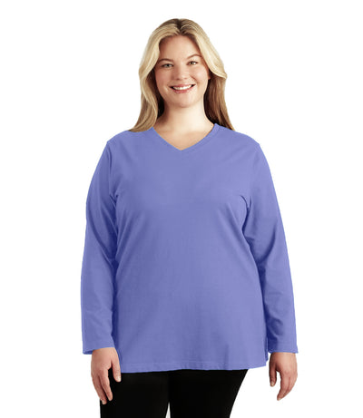 Plus size woman, facing front, wearing JunoActive plus size Stretch Naturals Long Sleeve V-Neck Top in the Cornflower Blue. She is wearing JunoActive Plus Size Leggings in the color Black.