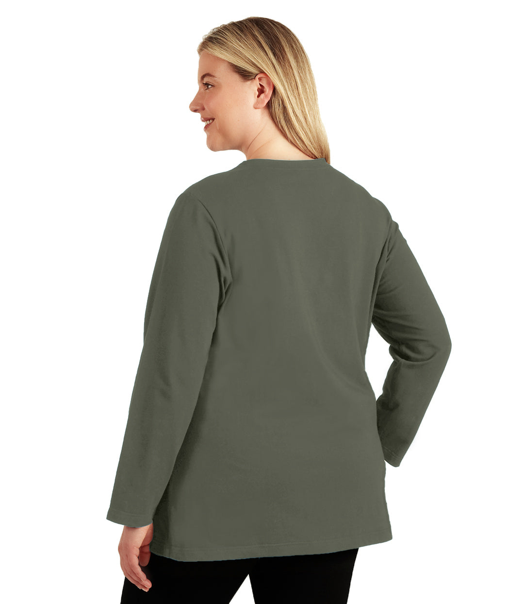 Plus size woman, facing back looking left, wearing JunoActive plus size Stretch Naturals Long Sleeve V-Neck Top in the color Moss Green. She is wearing JunoActive Plus Size Leggings in the color Black.
