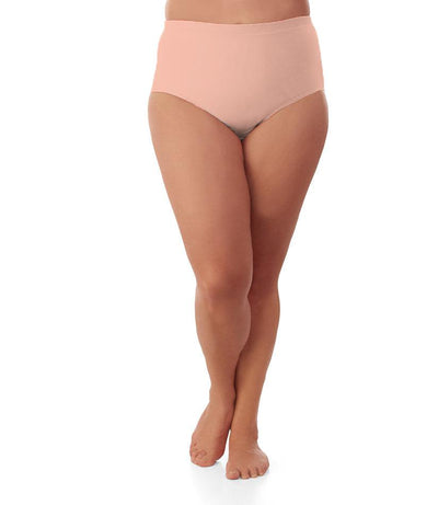 Bottom half of plus sized woman, facing front, wearing JunoActive Junowear Hush Briefs in peach. This brief fits to the waistline with conservative leg opening.