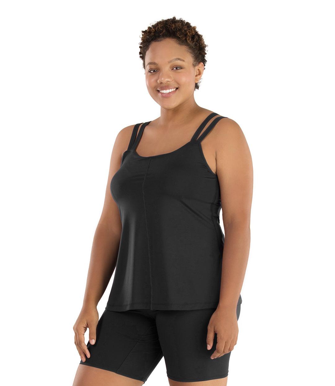 Plus size woman, facing front, wearing JunoActive plus size Junowear Hush Strappy Cami with Bra in Black. The woman is wearing a pair of Black Junowear Hush Boxer briefs.