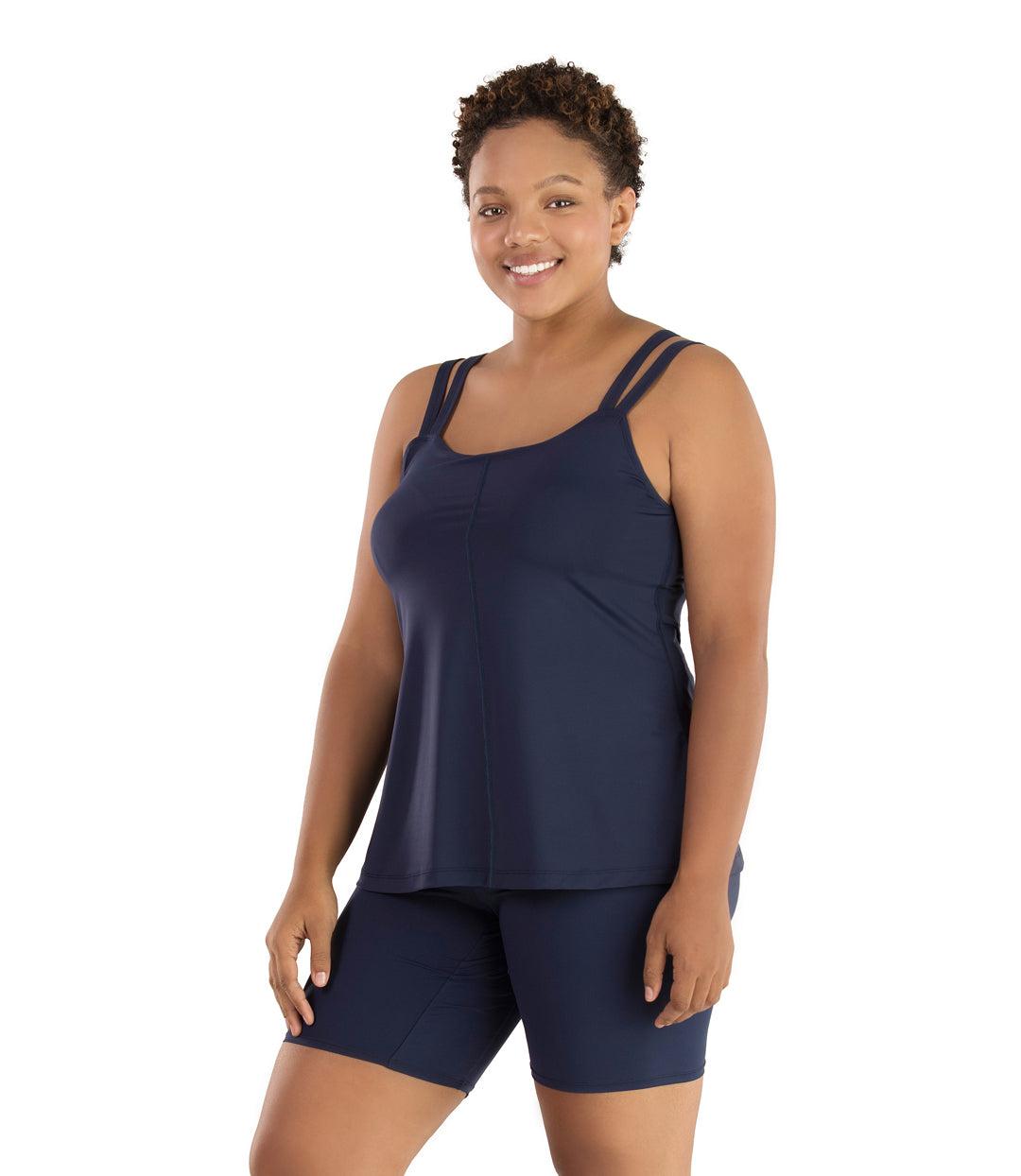 Plus size woman, facing front, wearing JunoActive plus size Junowear Hush Strappy Cami with Bra in Navy Blue. The woman is wearing a pair of Navy Blue Junowear Hush Boxer briefs.