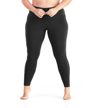 Bottom half of plus sized woman, front view, wearing JunoActive Stretch Naturals Leggings in color black. Bottom hem is at the ankle. 