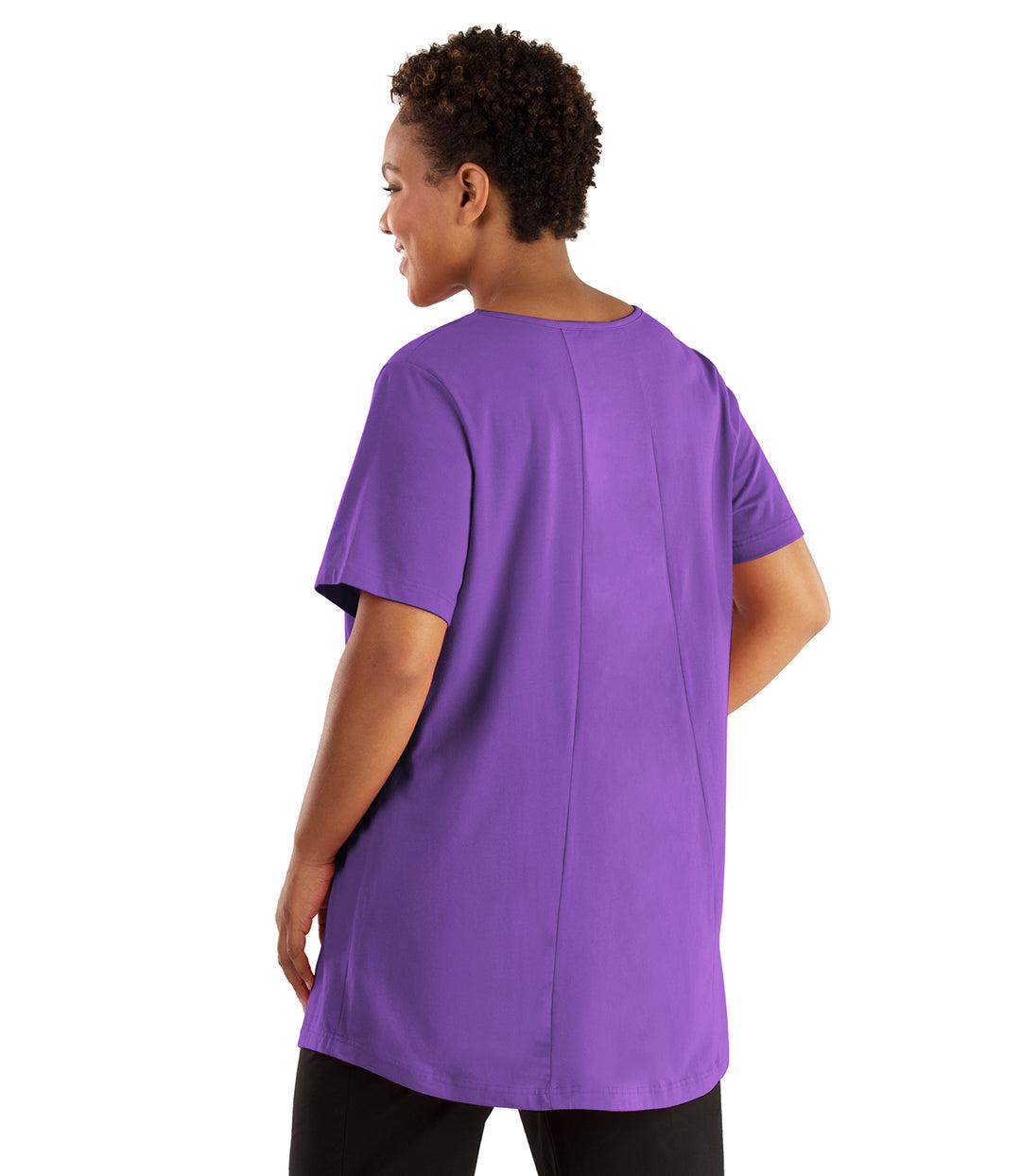 Plus size woman, facing front, wearing JunoActive plus size Stretch Naturals Lite Swing Top in the color Purple. She is wearing JunoActive Plus Size Leggings in the color black. 