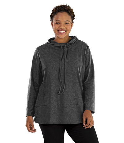 Plus size woman, facing front, wearing JunoActive plus size Stretch Naturals Cowl Top in the color Heather Charcoal. She is wearing JunoActive Plus Size Leggings in the color Black.